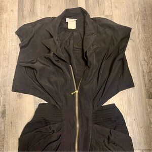 Vintage 80’s shoulder pad cut out midi dress
About size 6. Very unique